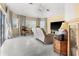Bright living room featuring a neutral palette, tile flooring, and plush seating at 4 Sportsman Ln, Rotonda West, FL 33947