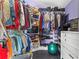 This large walk-in closet has rods, shelves, and built-in storage perfect for organization at 4 Sportsman Ln, Rotonda West, FL 33947
