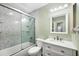 Full bathroom featuring shower and tub combo, single sink vanity, and updated fixtures at 4260 Placida Rd # 8D, Englewood, FL 34224