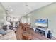 Inviting living room featuring an open floor plan, seamlessly connecting to the kitchen and dining area at 4260 Placida Rd # 8D, Englewood, FL 34224
