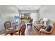 This bright living room boasts patio access, updated furniture, and sleek hardwood floors at 4260 Placida Rd # 8D, Englewood, FL 34224