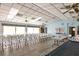 Bright community meeting room with ample seating and natural light from large windows at 4260 Placida Rd # 8D, Englewood, FL 34224