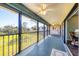 Enjoy a covered lanai featuring ceiling fans and views of the community's green space at 4260 Placida Rd # 8D, Englewood, FL 34224