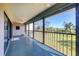 Relaxing screened patio with ample space and serene views of the well-maintained lawn at 4260 Placida Rd # 8D, Englewood, FL 34224