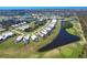 Amazing aerial view of home near golf course, lakes, and other beautiful houses at 6 Windward Ct, Placida, FL 33946