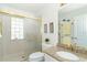 Well-lit bathroom with a glass block window and a modern vanity at 6 Windward Ct, Placida, FL 33946