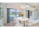 Breakfast nook with chandelier and views of the screened-in lanai and pool area at 6 Windward Ct, Placida, FL 33946