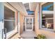 Inviting front entrance with a white trimmed windows and glass door entry at 6 Windward Ct, Placida, FL 33946