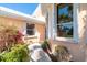 Charming single Gathering home with mature landscaping and a white trimmed windows at 6 Windward Ct, Placida, FL 33946