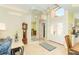 Open foyer with soaring ceilings, chandelier, statement mirror and dining room at 6 Windward Ct, Placida, FL 33946