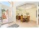 Open foyer with soaring ceilings, chandelier, statement mirror and dining room at 6 Windward Ct, Placida, FL 33946