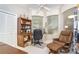 Cozy office space with built-in shelving, natural light, and comfortable seating at 6 Windward Ct, Placida, FL 33946