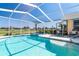 Inviting pool and attached spa, encased by a screened lanai offering a peaceful retreat with scenic vistas at 6 Windward Ct, Placida, FL 33946