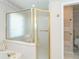Close-up of the bathroom shower, featuring glass doors and gold finishings at 6 Windward Ct, Placida, FL 33946