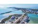 Stunning aerial view showcases beachfront condos near a serene pool and expansive ocean views at 6000 Boca Grande Cswy # D38, Boca Grande, FL 33921