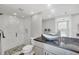 Bathroom with frameless glass shower, granite counters, and modern fixtures at 6000 Boca Grande Cswy # D38, Boca Grande, FL 33921