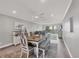 Light-filled dining area offers a view into the living area and beautiful outdoor scenery at 6000 Boca Grande Cswy # D38, Boca Grande, FL 33921