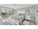 Serene main bedroom with balcony access and soft, coastal-inspired decor at 6000 Boca Grande Cswy # D38, Boca Grande, FL 33921