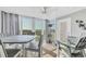 Bright sunroom with views, neutral decor, and a cozy place to relax or entertain at 6000 Boca Grande Cswy # D38, Boca Grande, FL 33921