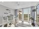 Bright sunroom with neutral decor, views, and sliding glass doors to the outside at 6000 Boca Grande Cswy # D38, Boca Grande, FL 33921