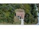 Aerial view showcases a private backyard, well-maintained roof, and long driveway at 6368 Pennell St, Englewood, FL 34224