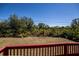 Backyard view from the deck, offering a private natural setting at 6368 Pennell St, Englewood, FL 34224