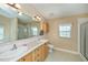 Bathroom with double sinks and shower room at 6368 Pennell St, Englewood, FL 34224