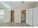 Neutral bedroom with open closet doors showcasing ample storage and wire shelving at 6368 Pennell St, Englewood, FL 34224