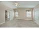 Spacious bedroom featuring neutral walls, two windows, and plush carpet at 6368 Pennell St, Englewood, FL 34224