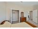 Well-lit bedroom featuring a comfortable bed, dresser, and a spacious closet at 6368 Pennell St, Englewood, FL 34224