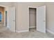 Bright bedroom with open closet featuring neutral carpet and trim at 6368 Pennell St, Englewood, FL 34224
