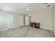 Neutral bedroom with ceiling fan, and built-in desk and view to bathroom at 6368 Pennell St, Englewood, FL 34224