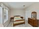 Cozy bedroom with classic furniture, including a wooden bed, dresser, and bedside tables at 6368 Pennell St, Englewood, FL 34224