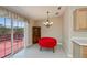 Dining area boasts sliding glass doors, a classic chandelier, and stylish decor at 6368 Pennell St, Englewood, FL 34224