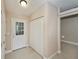 Welcoming foyer features tile flooring, a closet, and a front door with glass panes at 6368 Pennell St, Englewood, FL 34224