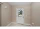 Bright foyer featuring tile flooring and a glass-paneled front door at 6368 Pennell St, Englewood, FL 34224