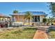 Backyard features grilling station, picnic table, and landscaped walkway at 6610 Gasparilla Pines Blvd # 113, Englewood, FL 34224