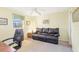 Comfortable room with ceiling fan and sofa perfect for relaxing or reading at 6610 Gasparilla Pines Blvd # 113, Englewood, FL 34224