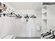 Spacious walk-in closet with adjustable shelving and hanging racks for organized storage at 6610 Gasparilla Pines Blvd # 113, Englewood, FL 34224