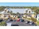 Apartment complex with well-maintained landscaping and ample parking at 6610 Gasparilla Pines Blvd # 113, Englewood, FL 34224