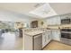 Beautiful kitchen with an open layout to the living room and stainless appliances at 6610 Gasparilla Pines Blvd # 113, Englewood, FL 34224