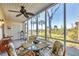 Inviting lanai with seating and views of lush greenery, perfect for outdoor dining or relaxation at 6610 Gasparilla Pines Blvd # 113, Englewood, FL 34224