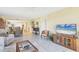 Open-concept living room combines the living area, dining space, and a modern kitchen at 6610 Gasparilla Pines Blvd # 113, Englewood, FL 34224
