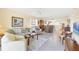Inviting living space features neutral decor and an open layout to the dining and kitchen areas at 6610 Gasparilla Pines Blvd # 113, Englewood, FL 34224