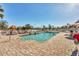 Community pool area with plenty of lounge chairs and well maintained grounds at 6610 Gasparilla Pines Blvd # 113, Englewood, FL 34224