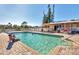 Community pool offers a refreshing oasis with ample space for relaxation at 6610 Gasparilla Pines Blvd # 113, Englewood, FL 34224
