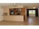 Open-concept floor plan seamlessly connecting the kitchen, and living areas, perfect for entertaining at 6980 Tuxedo St, Englewood, FL 34224