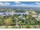 Waterfront property featuring mature landscaping and access to a serene lake perfect for relaxation at 730 Buckskin Ct, Englewood, FL 34223
