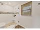 Walk-in shower with glass door, tile, and window with privacy shade at 730 Buckskin Ct, Englewood, FL 34223
