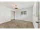 Neutral bedroom with carpet, a ceiling fan, and a window that provides natural light at 730 Buckskin Ct, Englewood, FL 34223